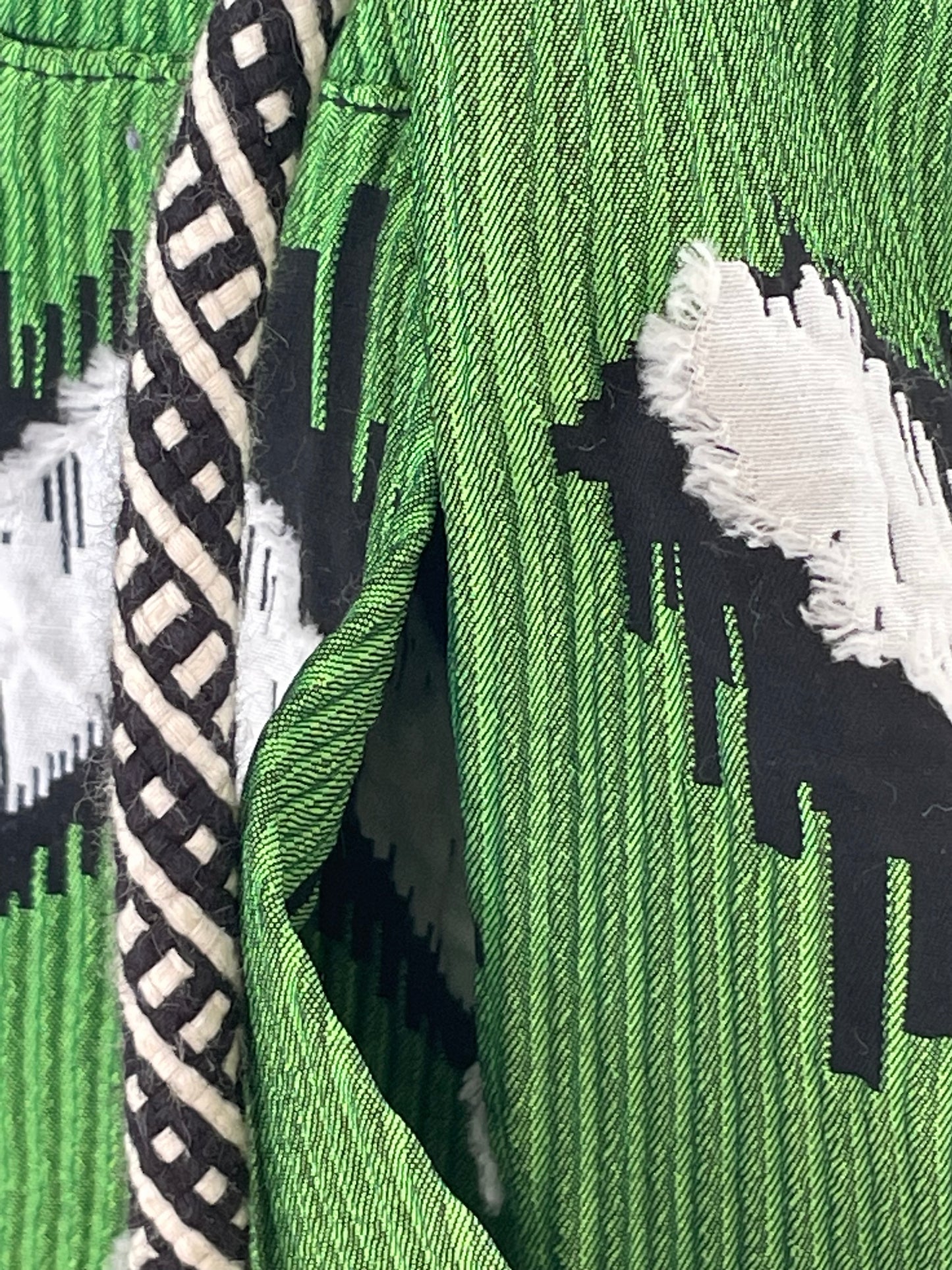 Jean-Paul Lespagnard green, white and black graphic "wheel traces" jacquard waist coat