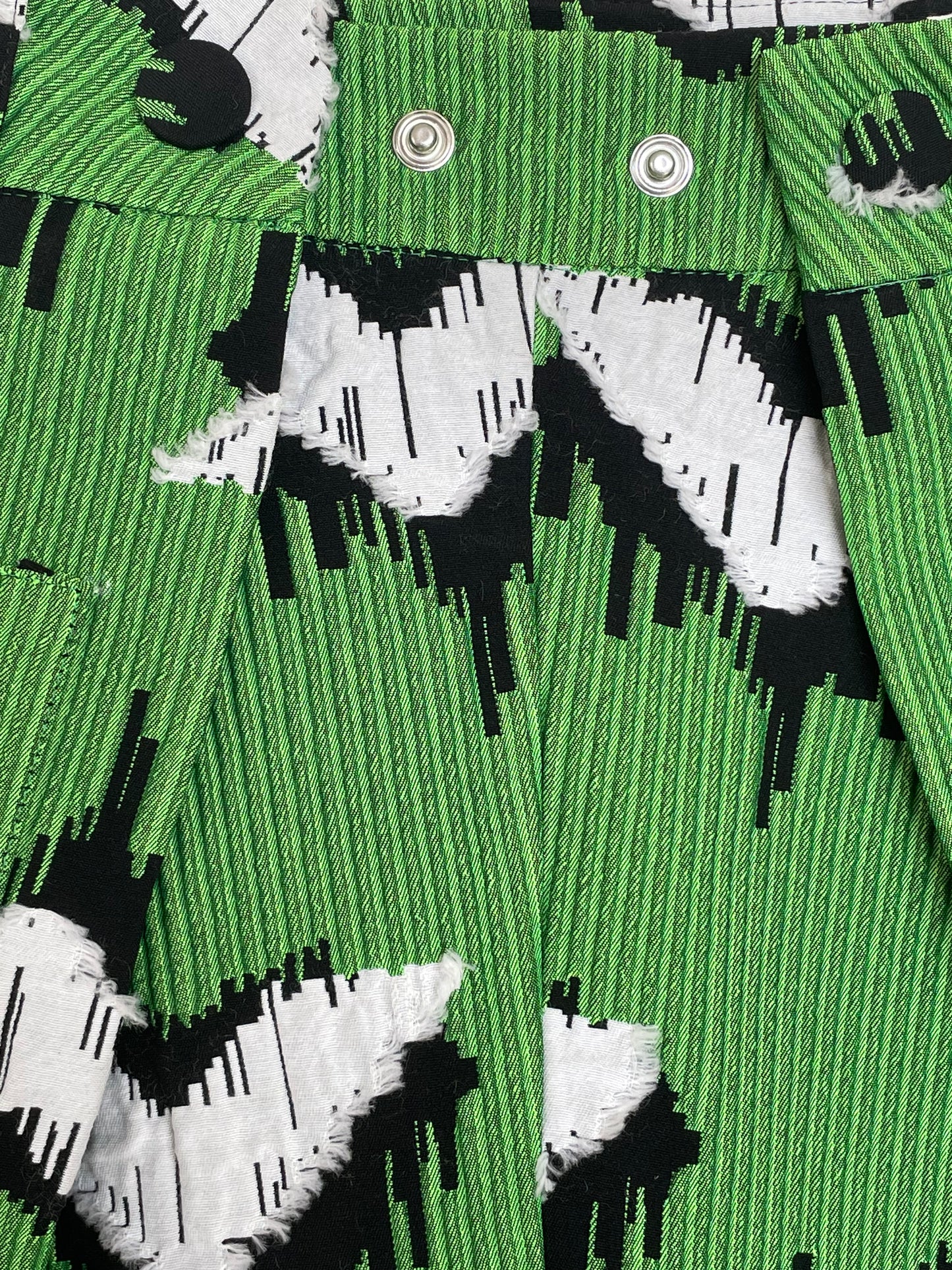 Jean-Paul Lespagnard pleated green, black and white jacquard trousers with "traces of wheels" pattern