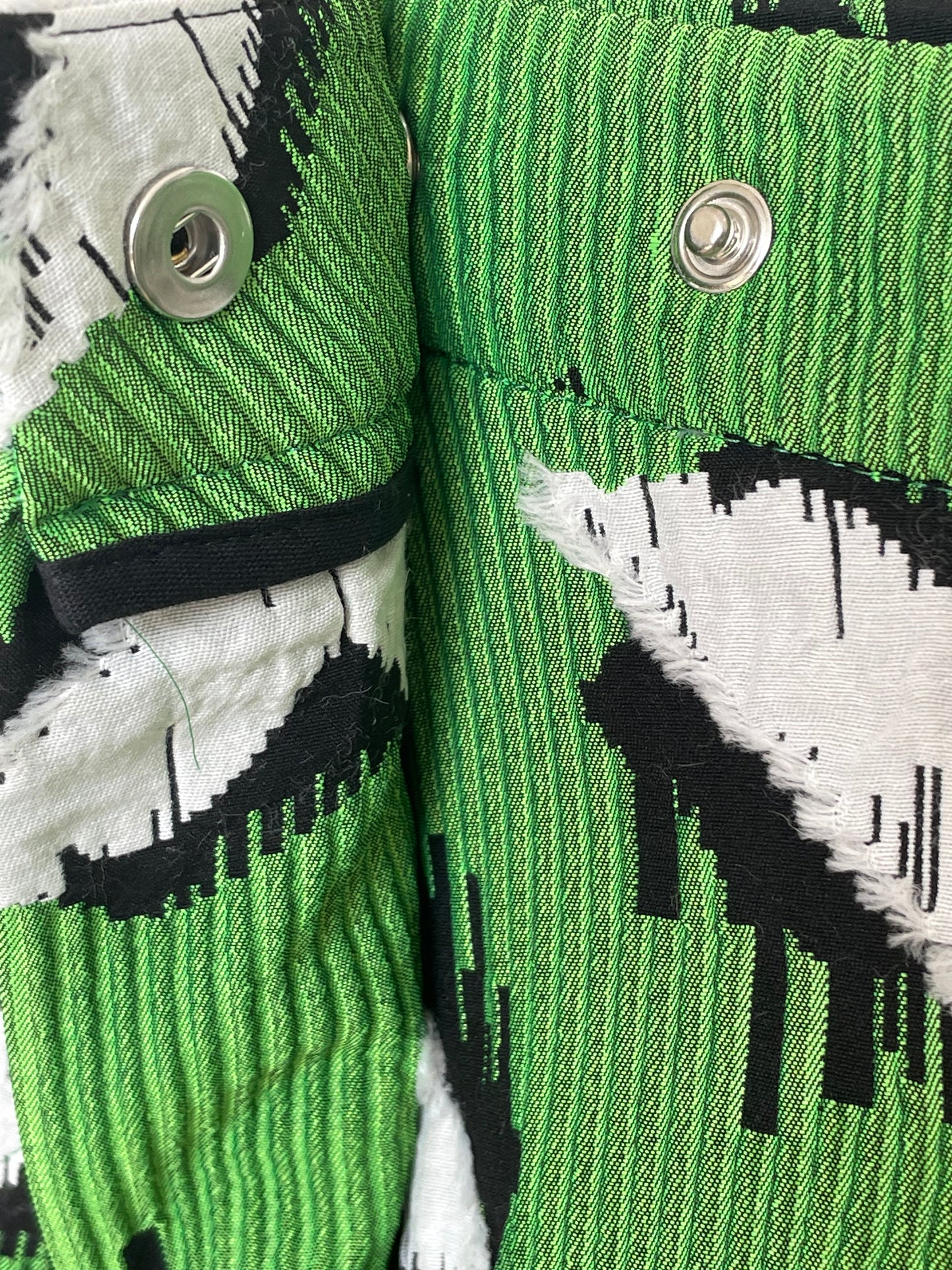 Jean-Paul Lespagnard pleated green, black and white jacquard trousers with "traces of wheels" pattern