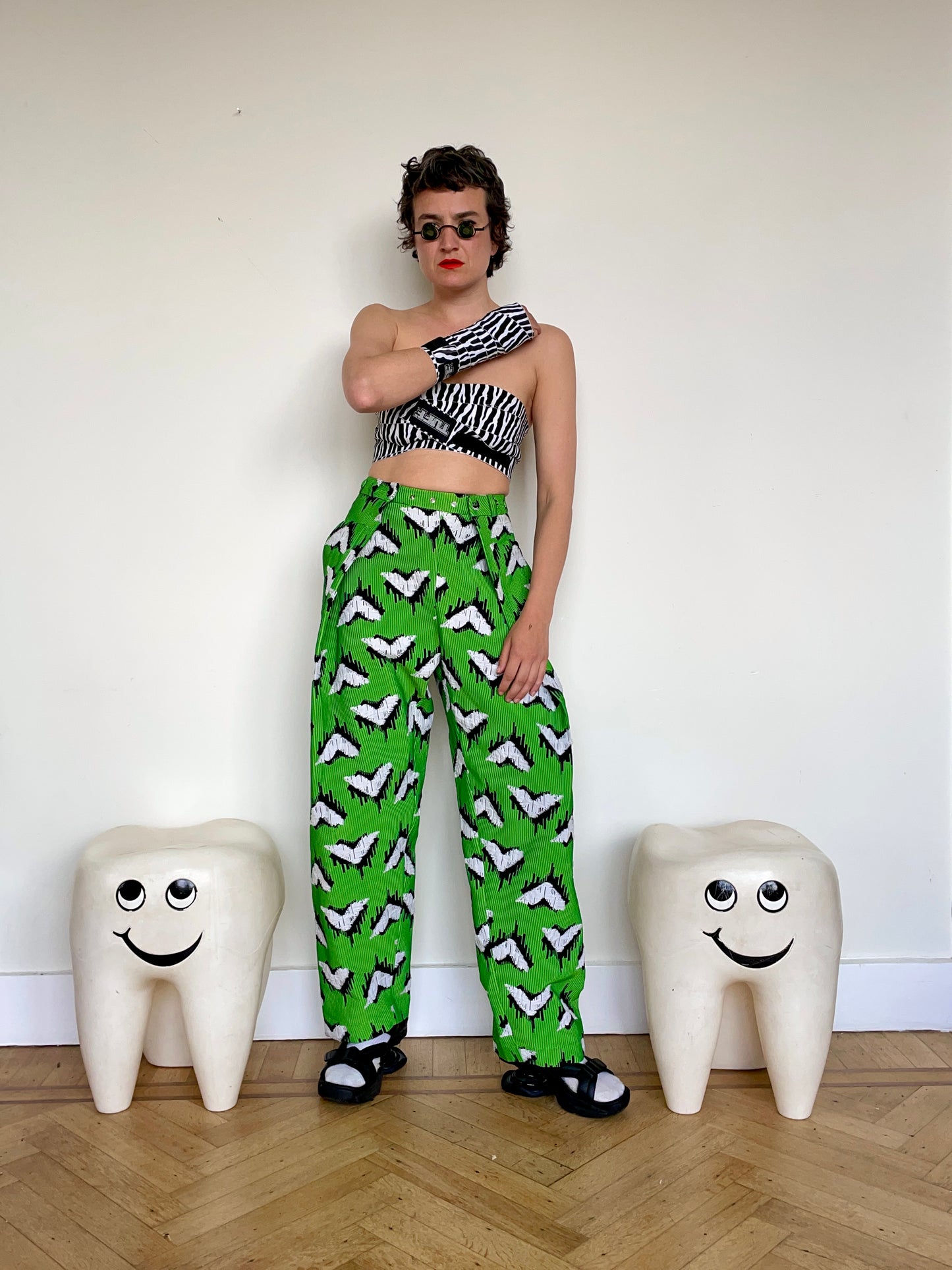 Jean-Paul Lespagnard pleated green, black and white jacquard trousers with "traces of wheels" pattern