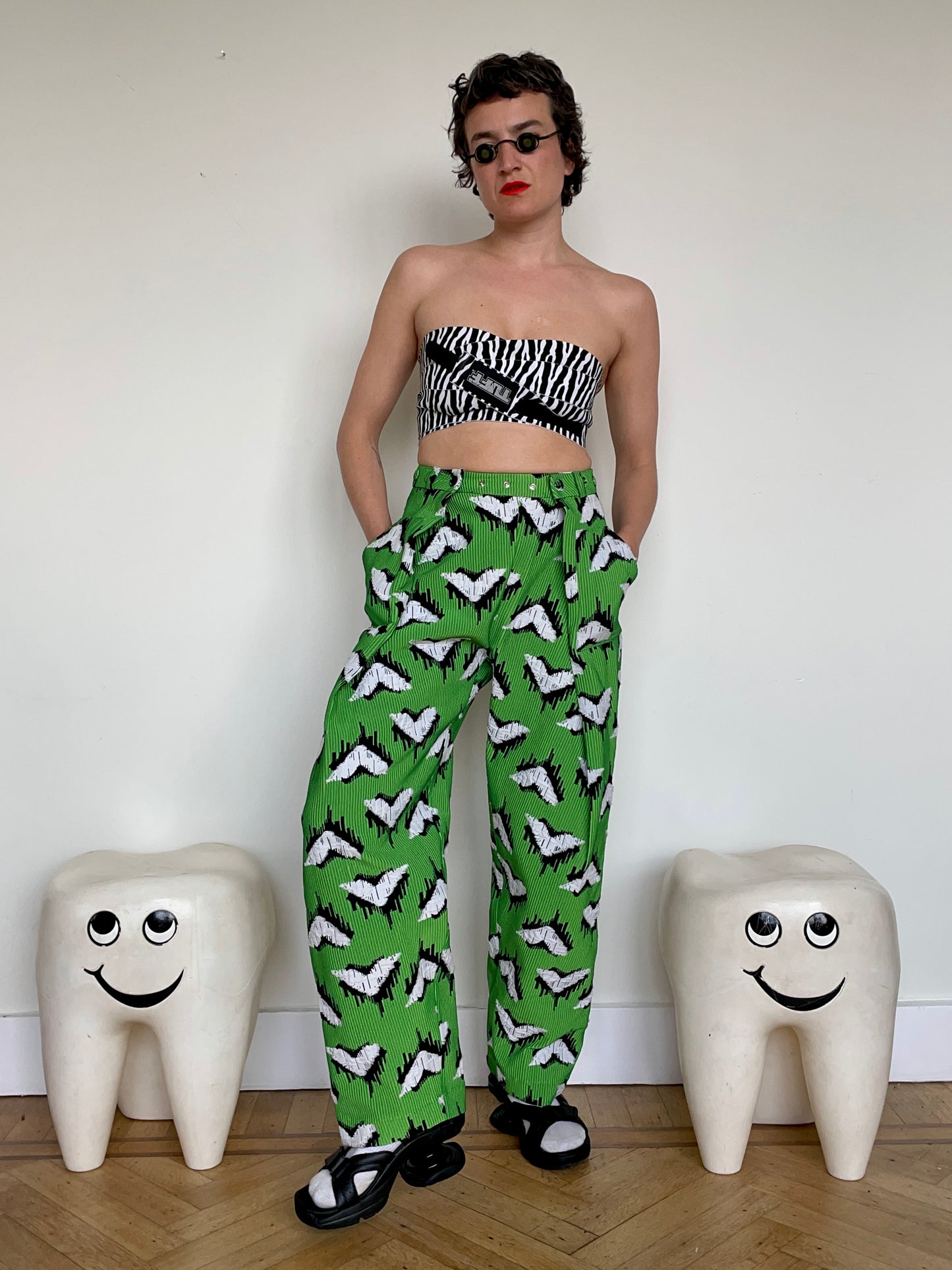 Jean-Paul Lespagnard pleated green, black and white jacquard trousers with "traces of wheels" pattern
