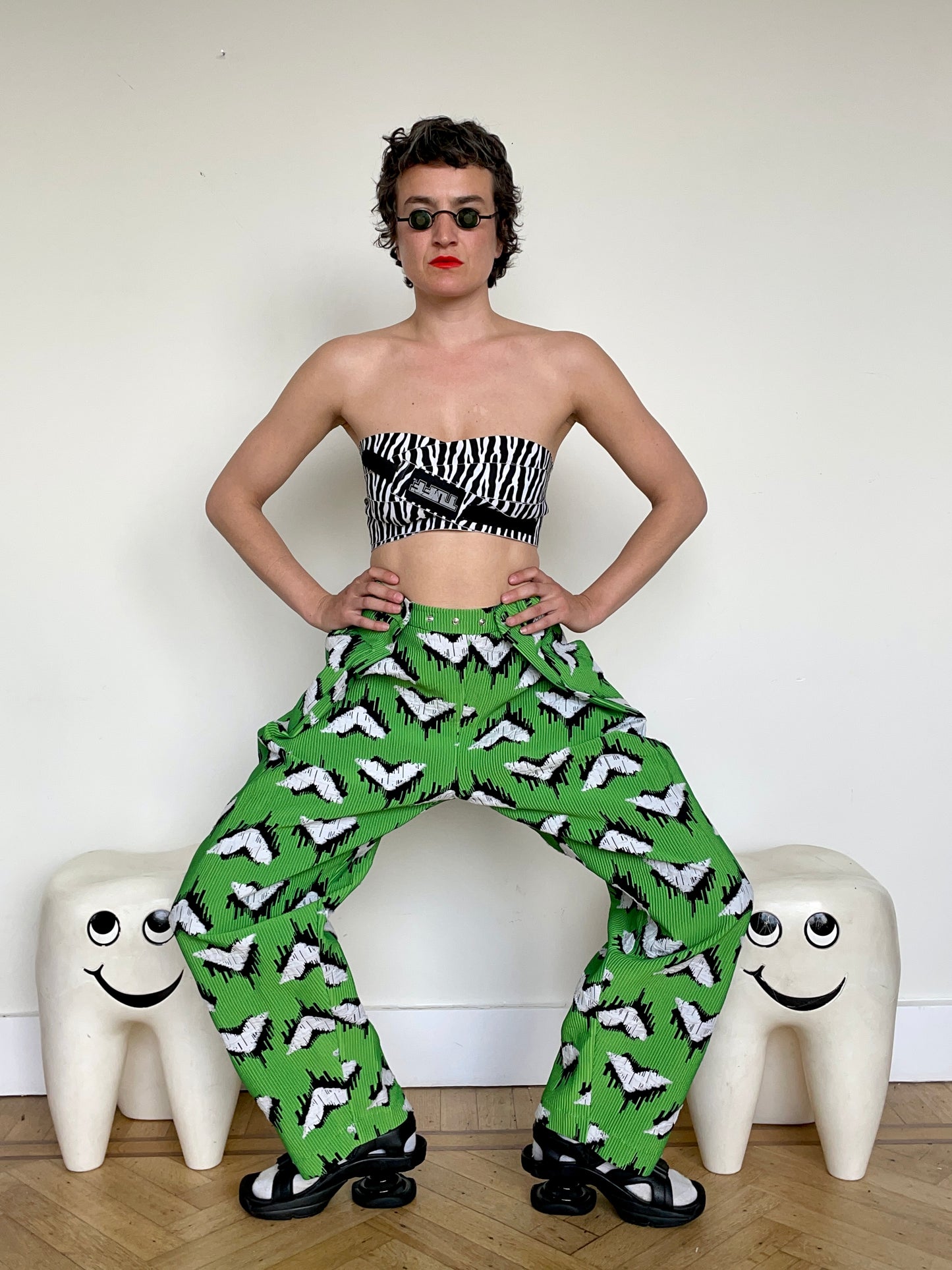 Jean-Paul Lespagnard pleated green, black and white jacquard trousers with "traces of wheels" pattern