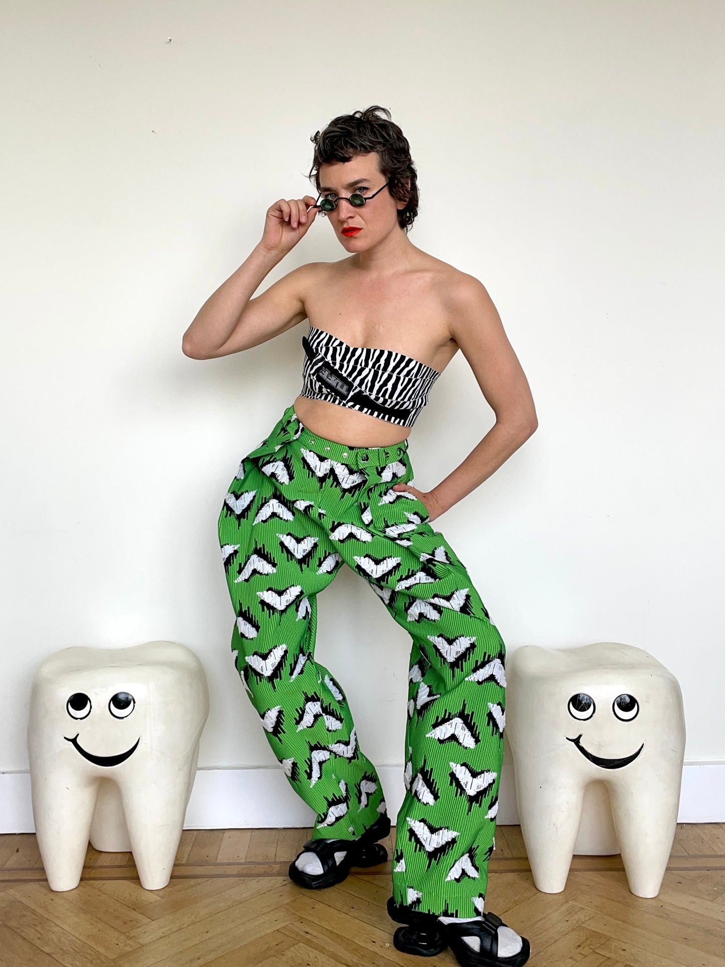 Jean-Paul Lespagnard pleated green, black and white jacquard trousers with "traces of wheels" pattern
