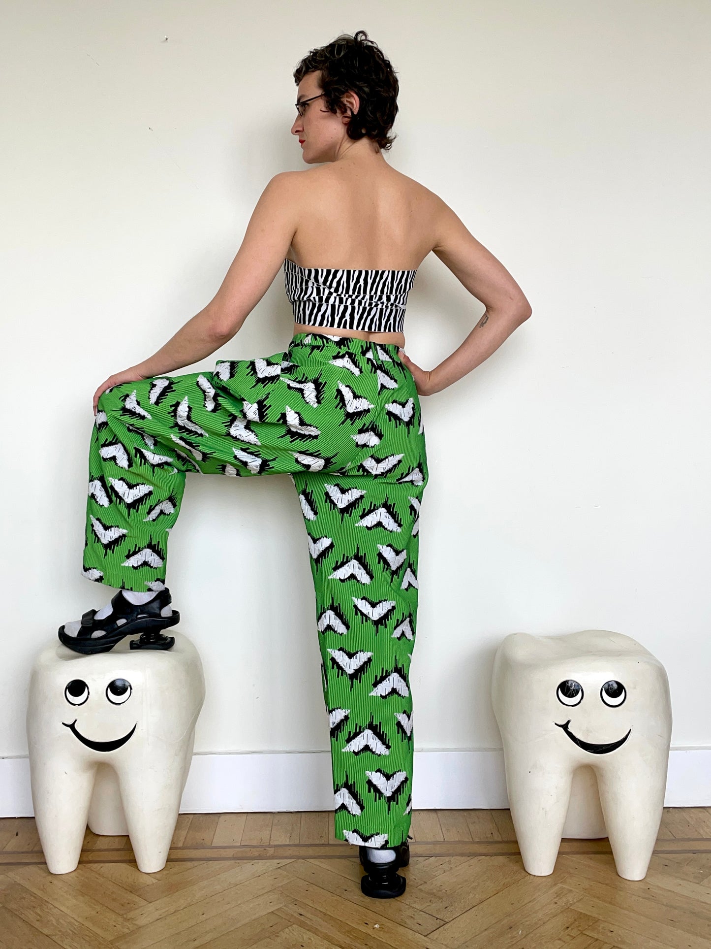 Jean-Paul Lespagnard pleated green, black and white jacquard trousers with "traces of wheels" pattern
