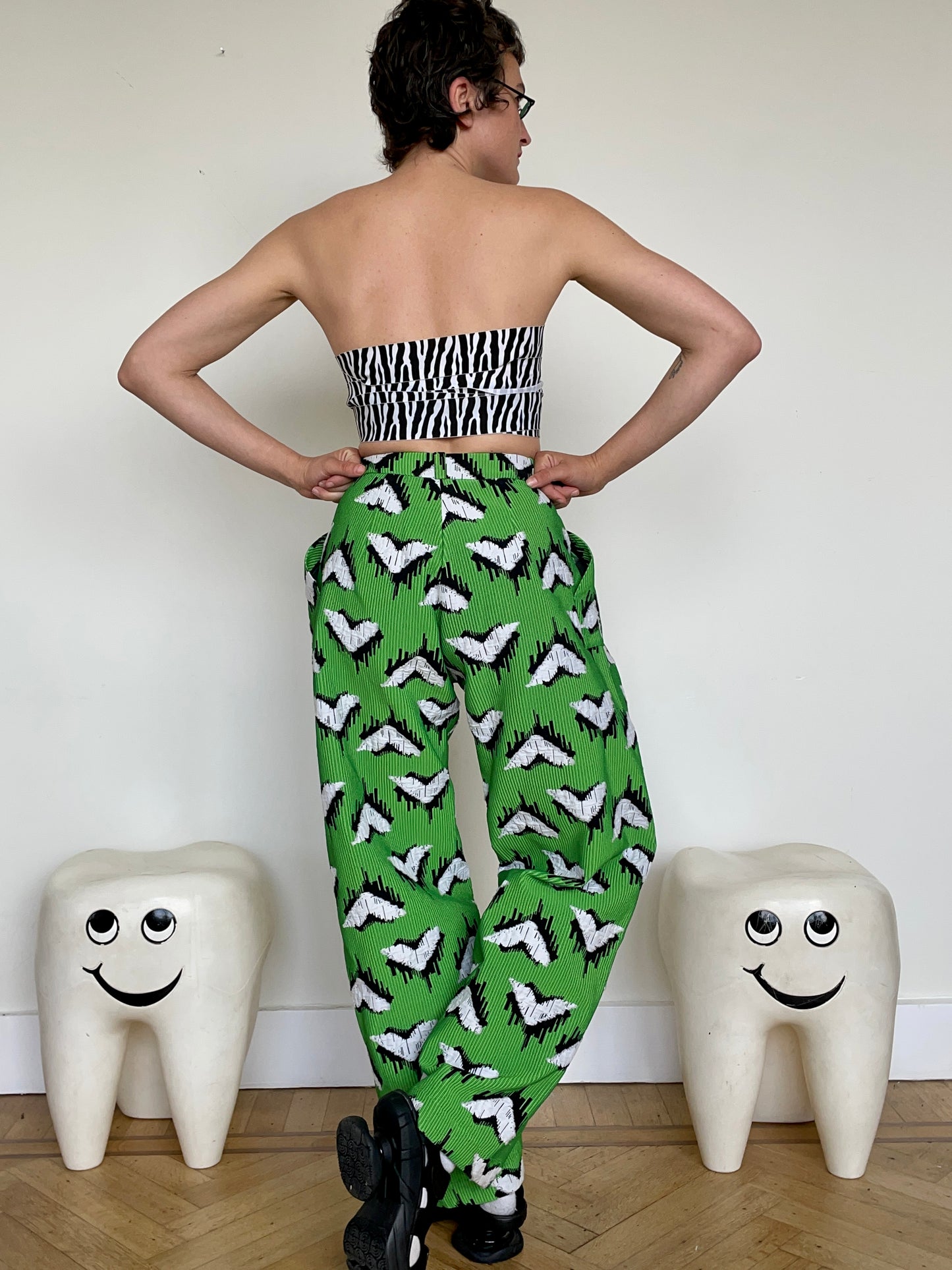 Jean-Paul Lespagnard pleated green, black and white jacquard trousers with "traces of wheels" pattern