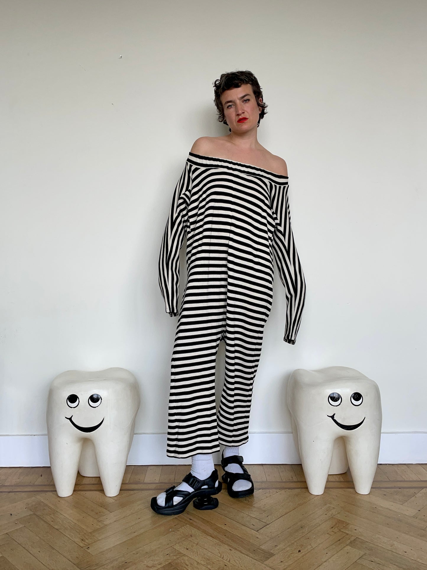 Jean-Paul Lespagnard's black and white striped knit hybrid jumpsuit / trousers