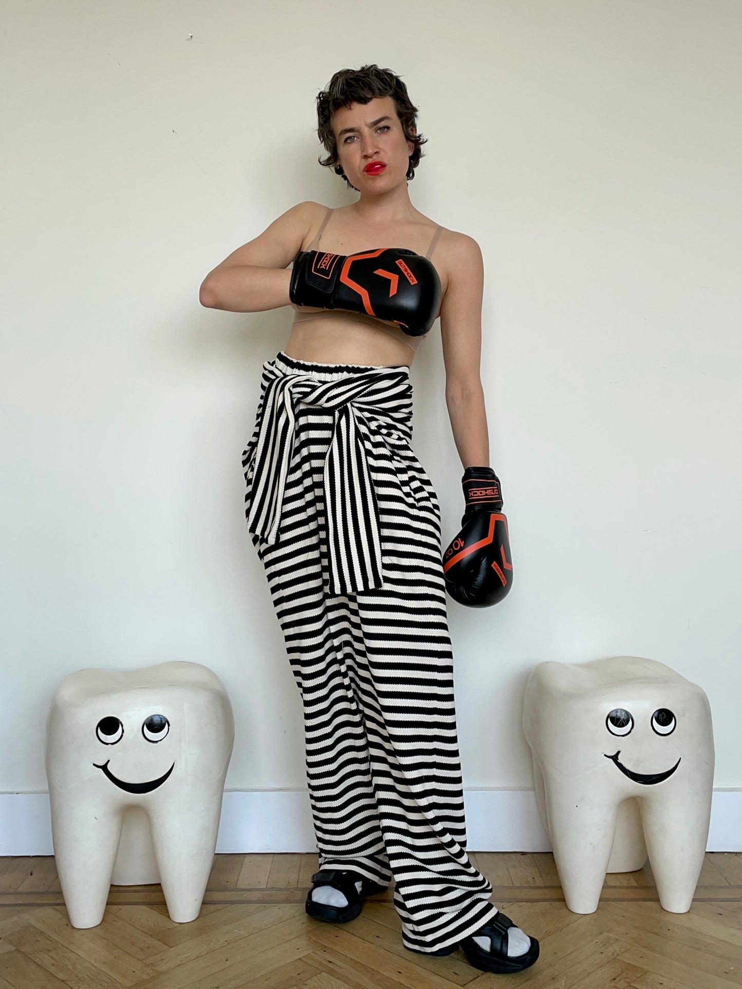 Jean-Paul Lespagnard's black and white striped knit hybrid jumpsuit / trousers