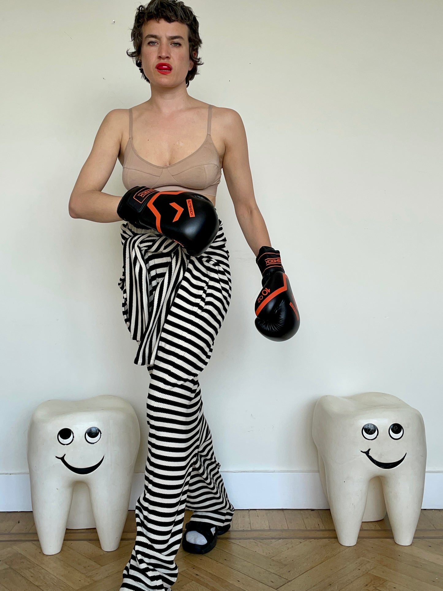 Jean-Paul Lespagnard's black and white striped knit hybrid jumpsuit / trousers