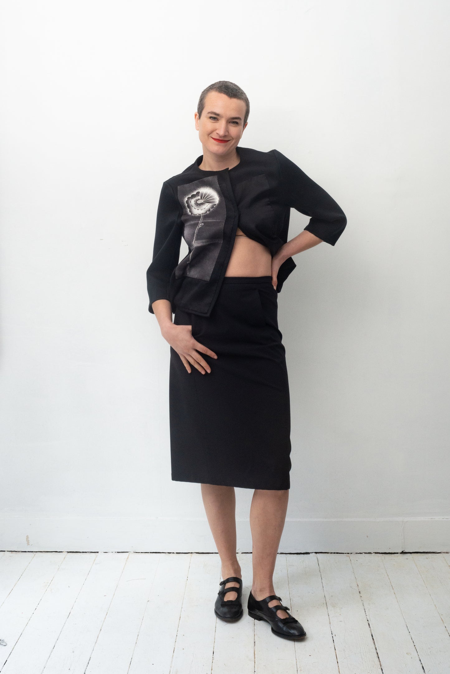 Prada 2000's black nylon midi skirt with velcro front pockets and leather belt detail