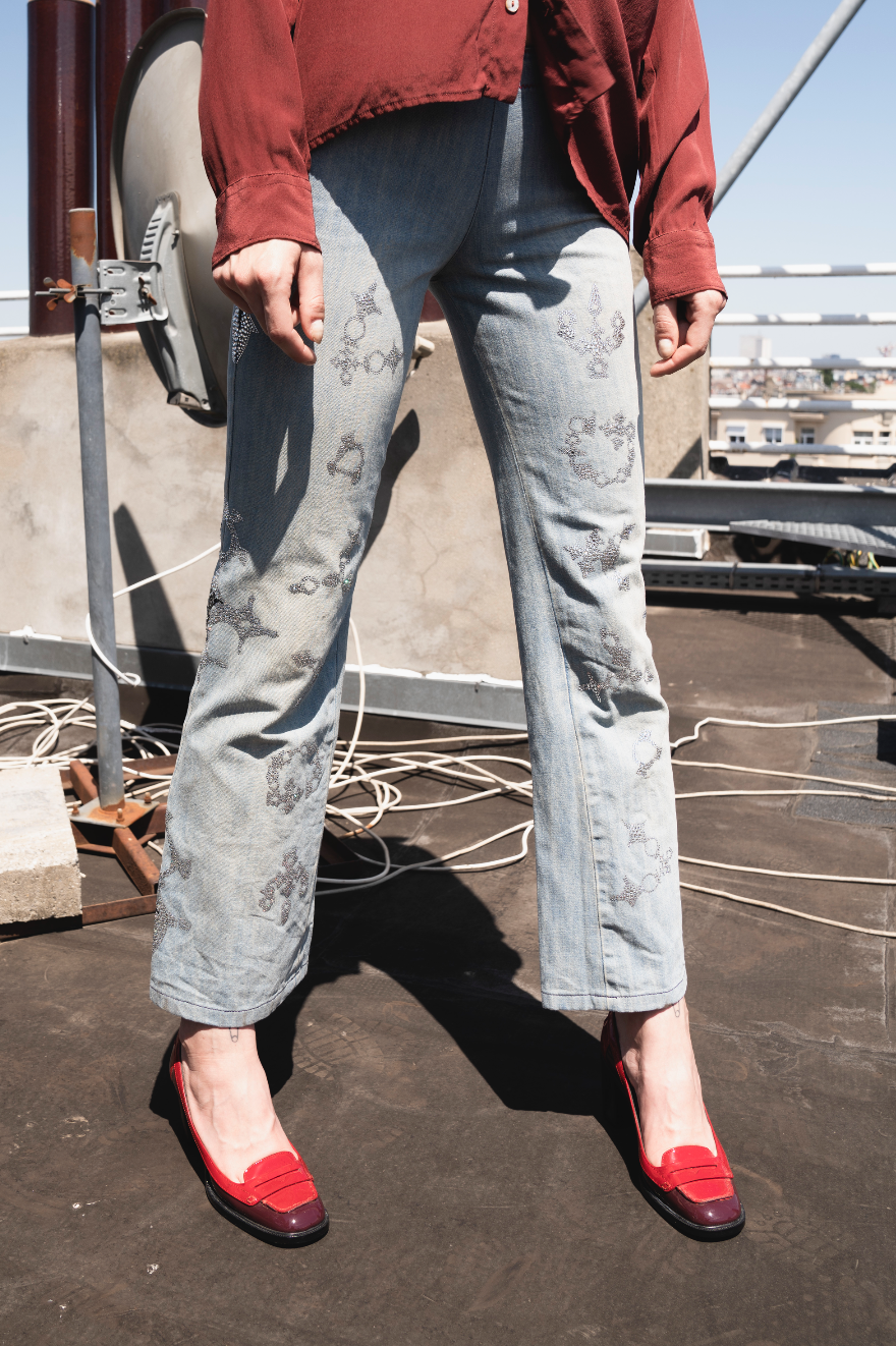 Voyage washed denim low waist trousers with tribal shaped gemstones