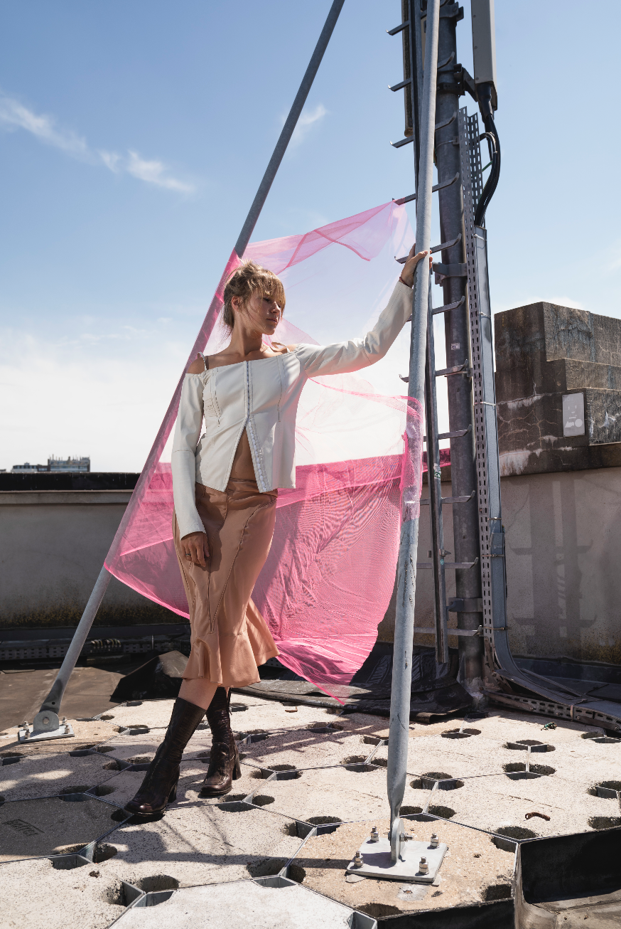 Costume National white leather top with bare shoulders