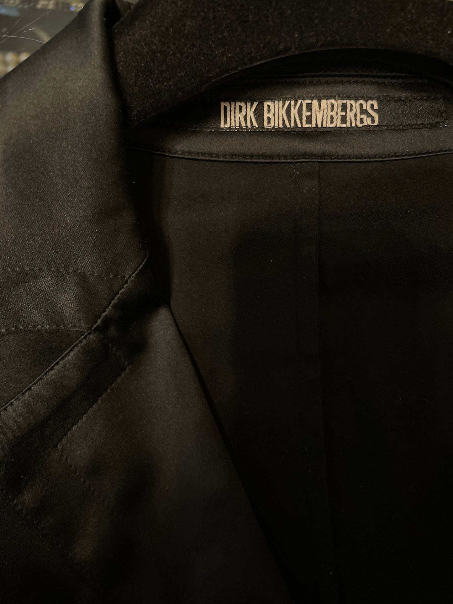 Dirk Bikkemberg 2000's black body suit with golden clasps.