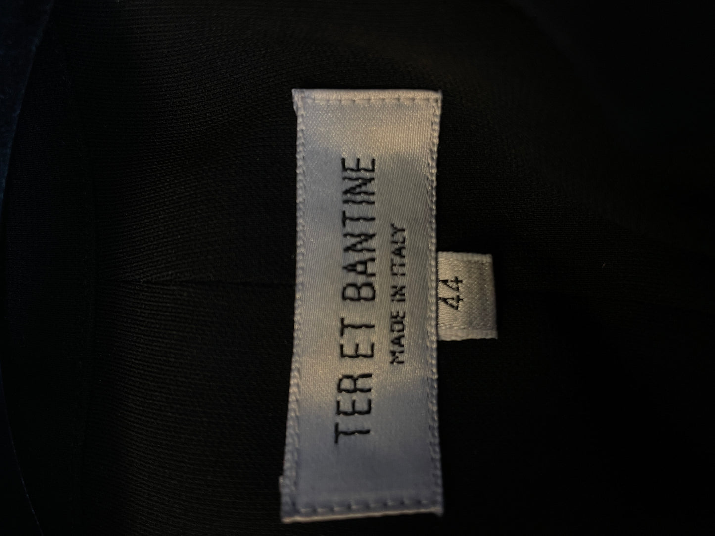 Ter & Bantine 2000's black flared jumpsuit with row of bows