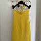 Claude Montana 80's yellow tube dress with swirling tube neck strap.