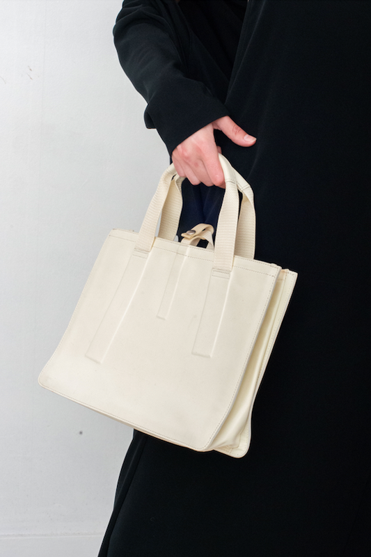 Issey Miyake eggshell rubber handbag