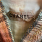 Chanel Haute Couture 1970s green tweed skirt suit with golden turtle buttons.