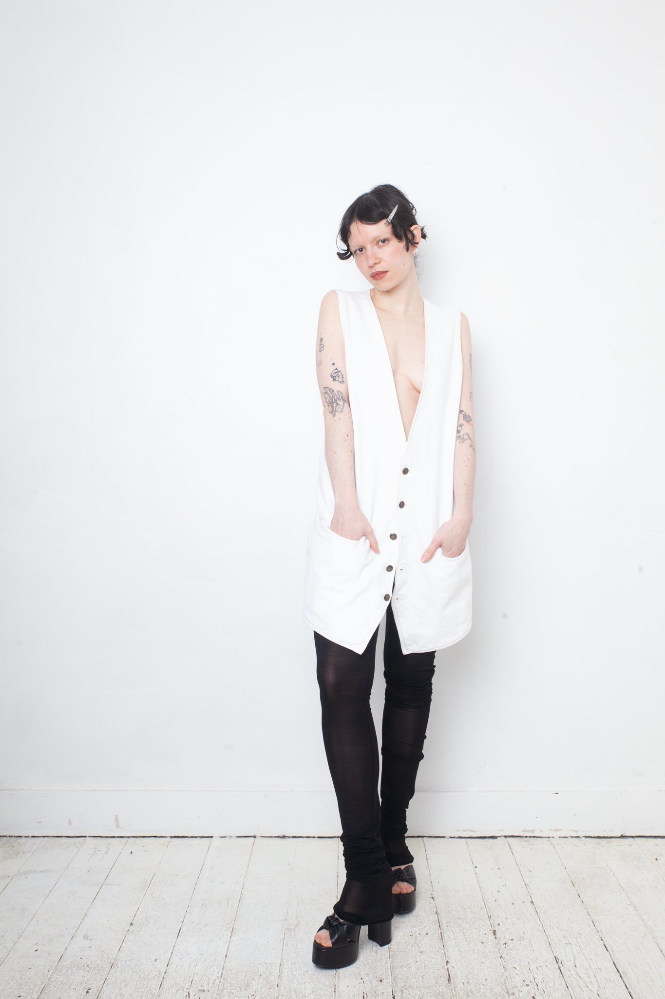 Ann Demeulemeester SS 2022 white denim oversized gilet with back slit and belts