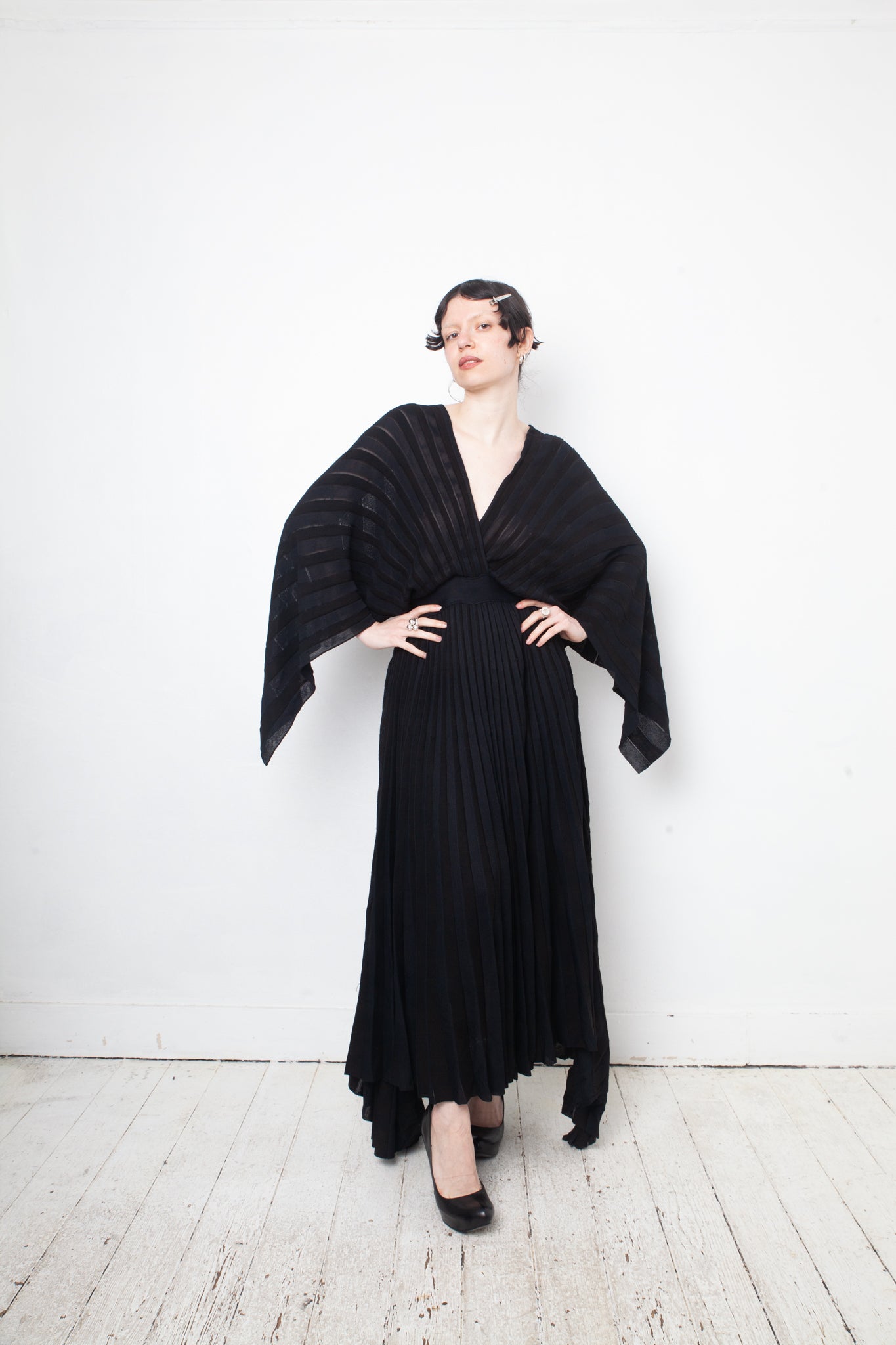 Valentino black heavy knit evening gown with deep V neck and open back