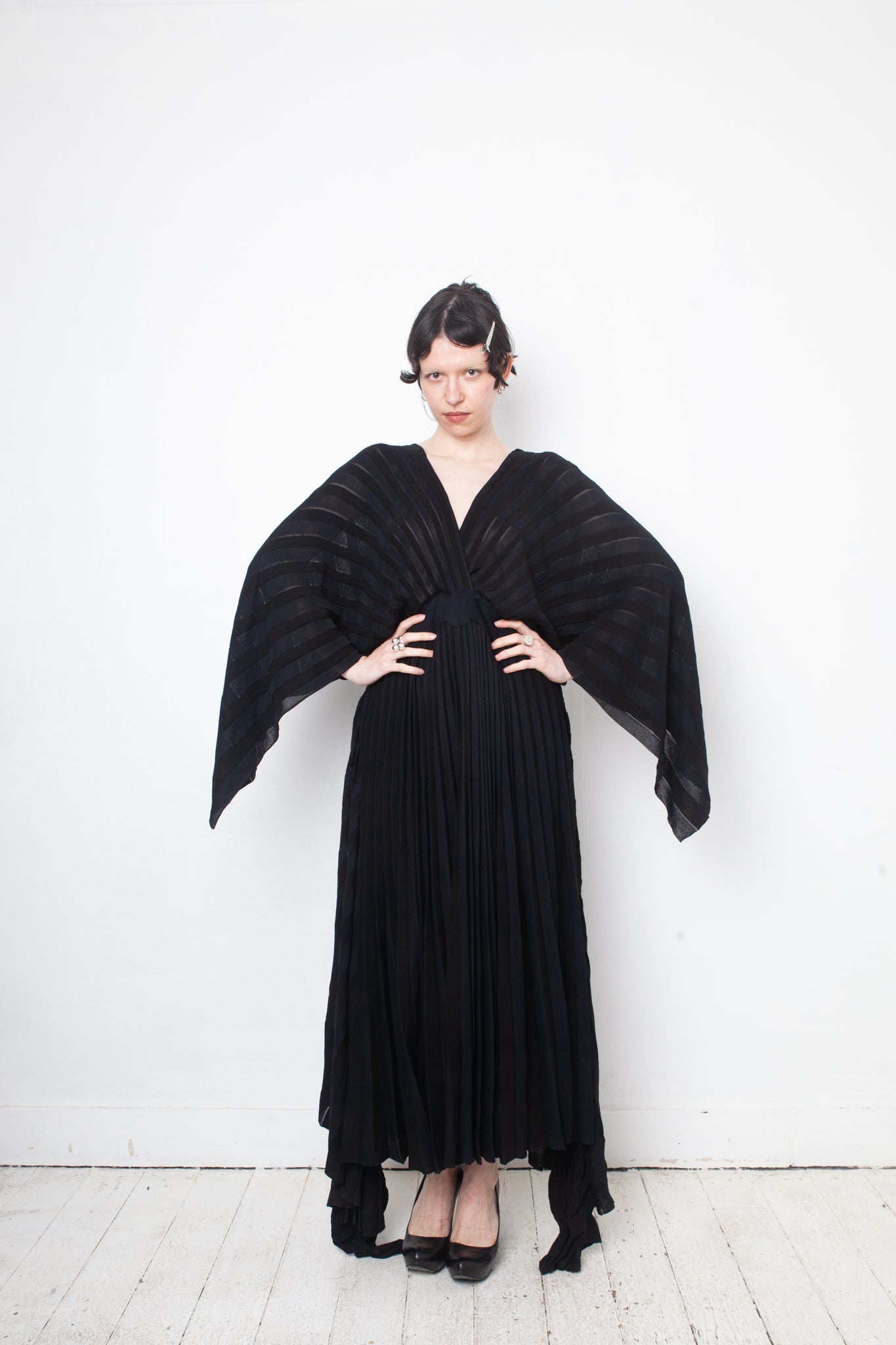 Valentino black heavy knit evening gown with deep V neck and open back