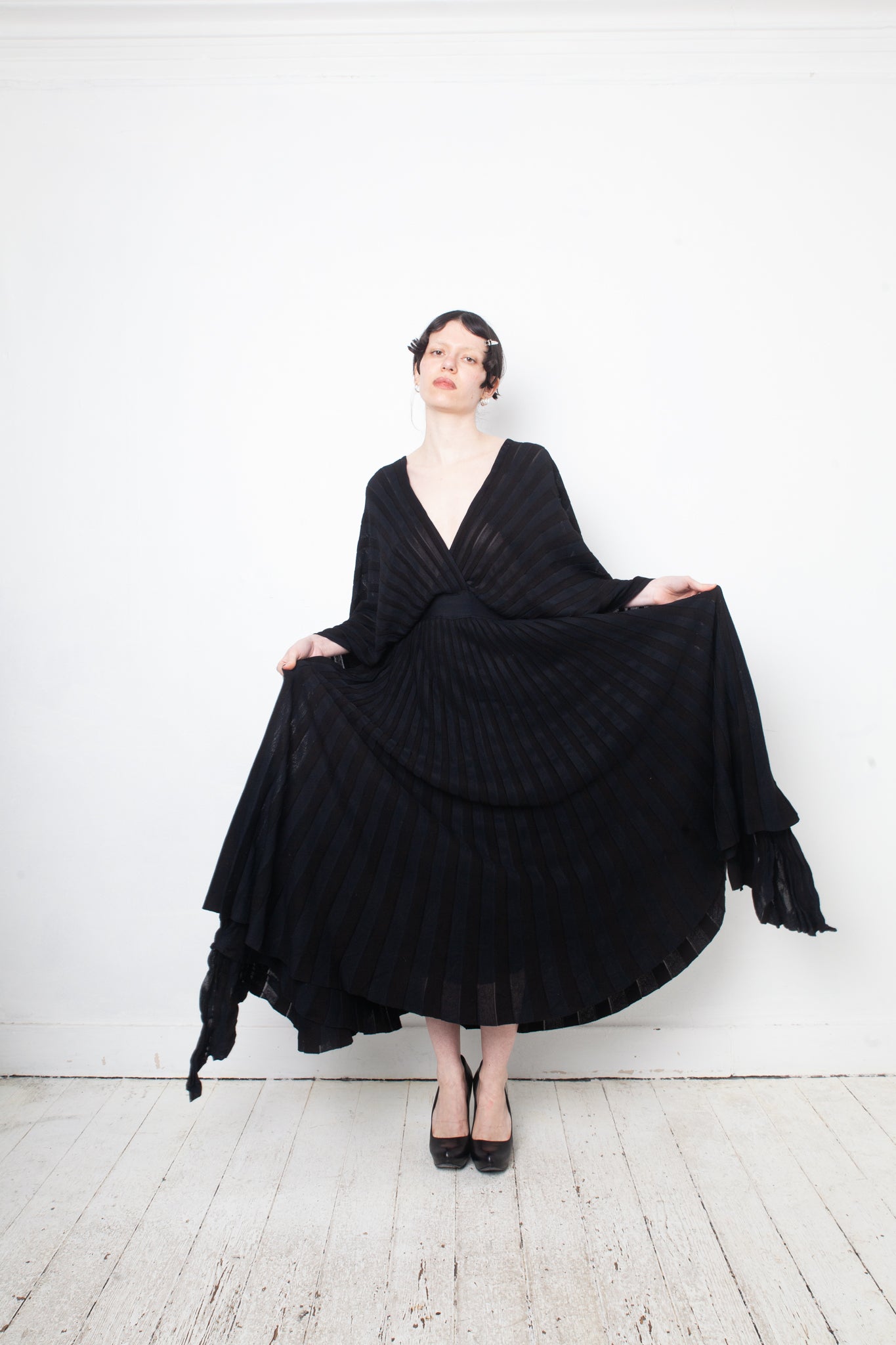 Valentino black heavy knit evening gown with deep V neck and open back