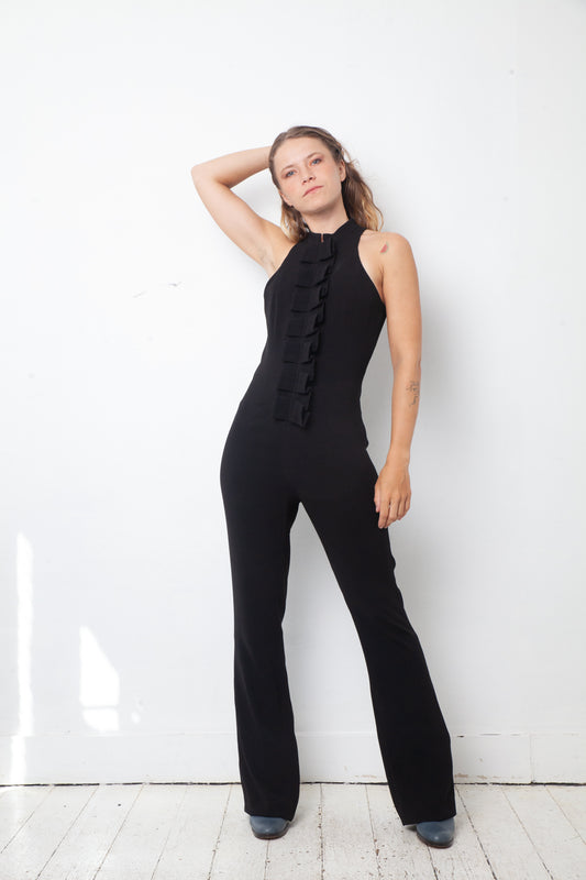 Ter & Bantine 2000's black flared jumpsuit with row of bows