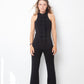 Ter & Bantine 2000's black flared jumpsuit with row of bows