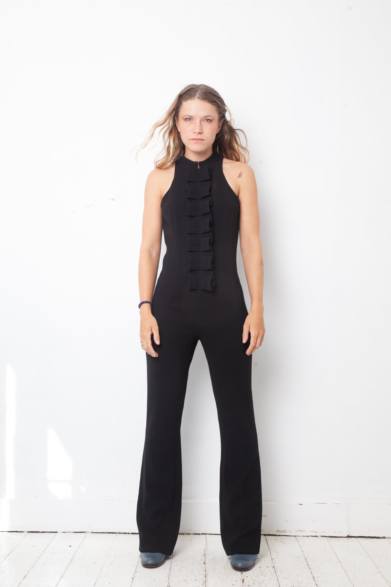 Ter & Bantine 2000's black flared jumpsuit with row of bows