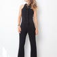 Ter & Bantine 2000's black flared jumpsuit with row of bows