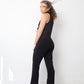 Ter & Bantine 2000's black flared jumpsuit with row of bows