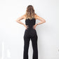 Ter & Bantine 2000's black flared jumpsuit with row of bows