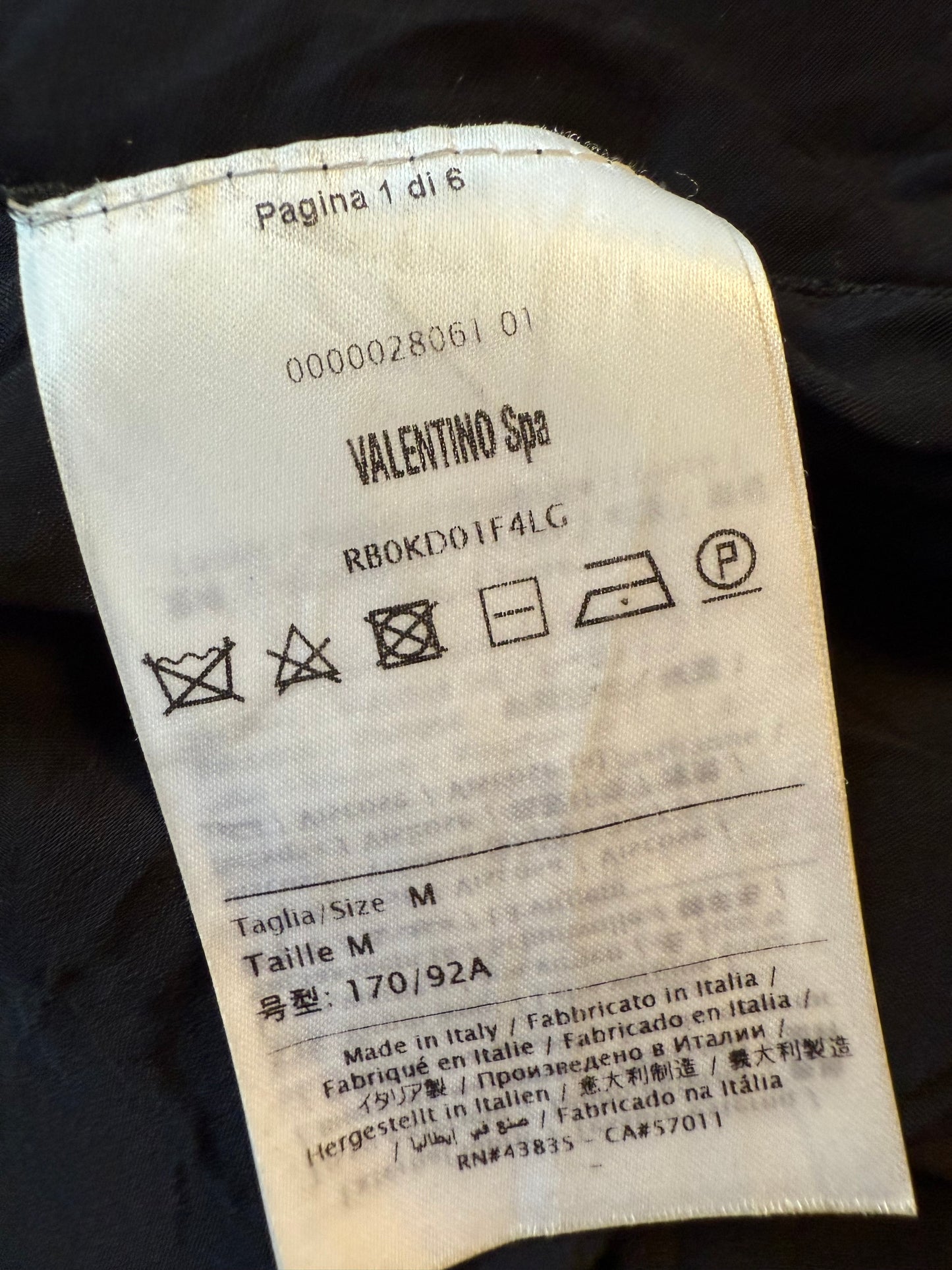 Valentino black heavy knit evening gown with deep V neck and open back