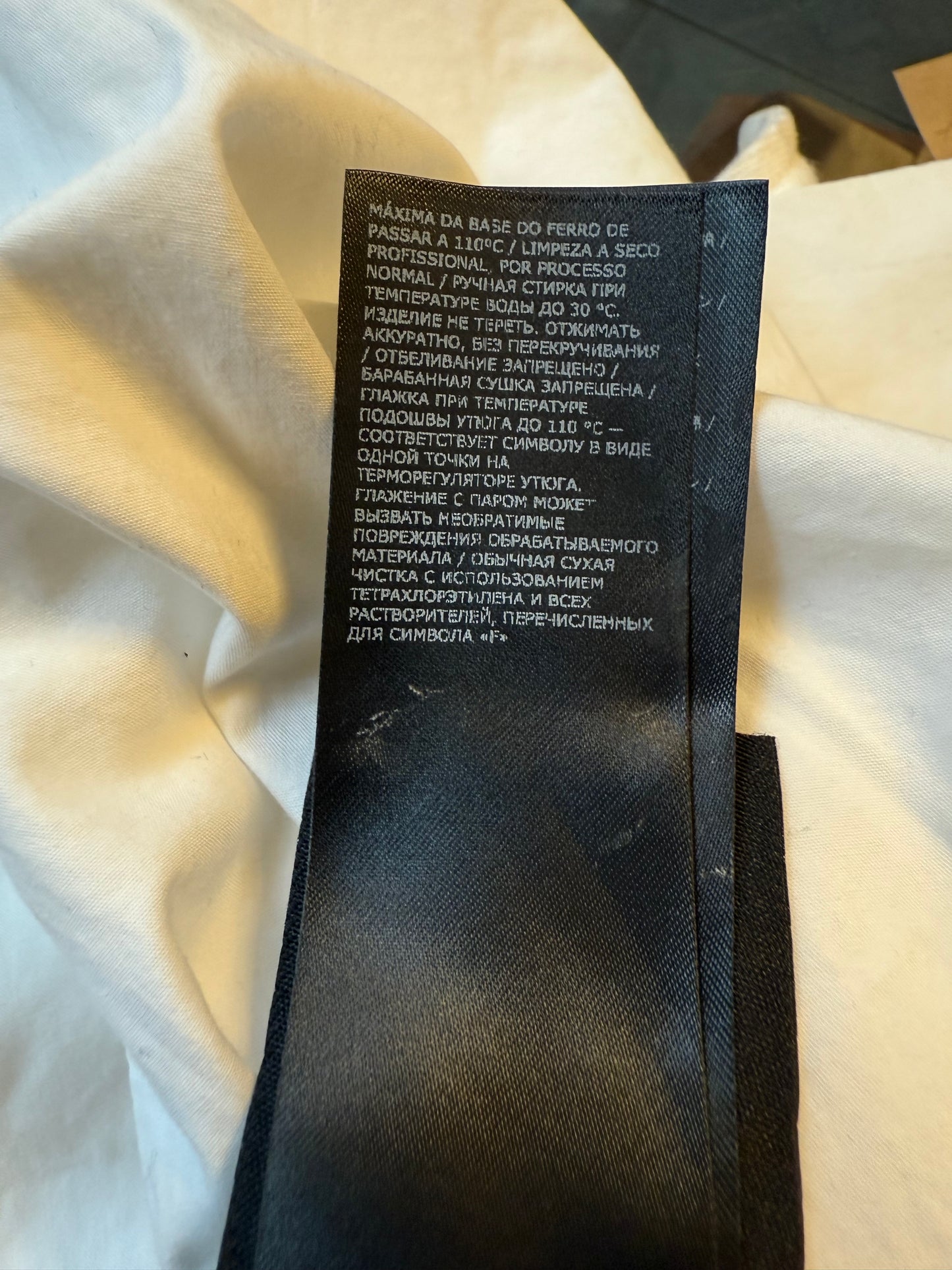 Ann Demeulemeester SS 2022 white denim oversized gilet with back slit and belts