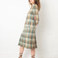 Chanel Haute Couture 1970s green tweed skirt suit with golden turtle buttons.