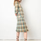 Chanel Haute Couture 1970s green tweed skirt suit with golden turtle buttons.