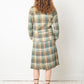 Chanel Haute Couture 1970s green tweed skirt suit with golden turtle buttons.