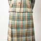 Chanel Haute Couture 1970s green tweed skirt suit with golden turtle buttons.