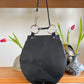 Collection Privée 2000's leather and satin black twisted hobo bag with circle handles