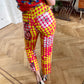 Christian Lacroix 90's op art red and yellow high waisted jeans with B/W face prints