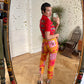 Christian Lacroix 90's op art red and yellow high waisted jeans with B/W face prints