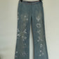 Voyage washed denim low waist trousers with tribal shaped gemstones