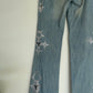 Voyage washed denim low waist trousers with tribal shaped gemstones