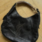Saint Laurent 2000's iconic Mombasa handbag in black with YSL logo in studs